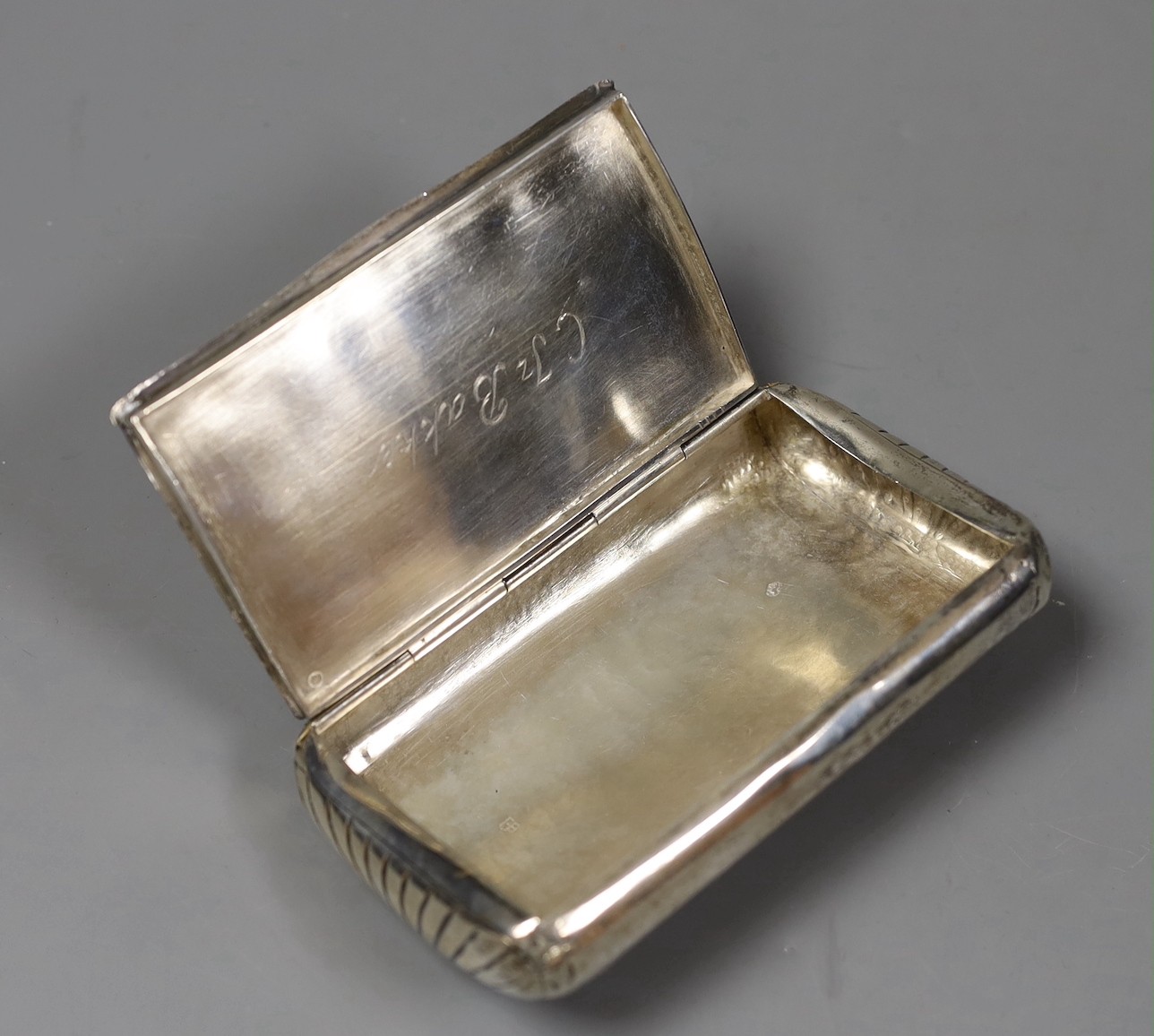A 19th century Dutch 833 standard white metal tobacco box, engraved with animals in farmyard scene, 13.1cm, 159 grams.